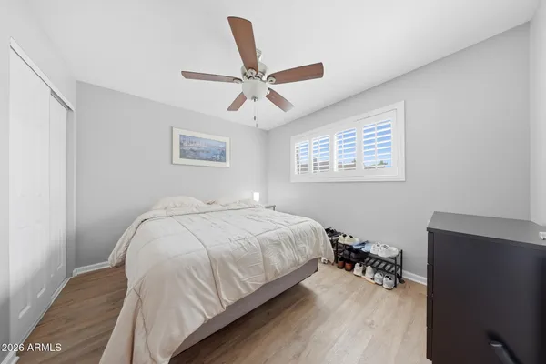 a bedroom with a bed and a desk