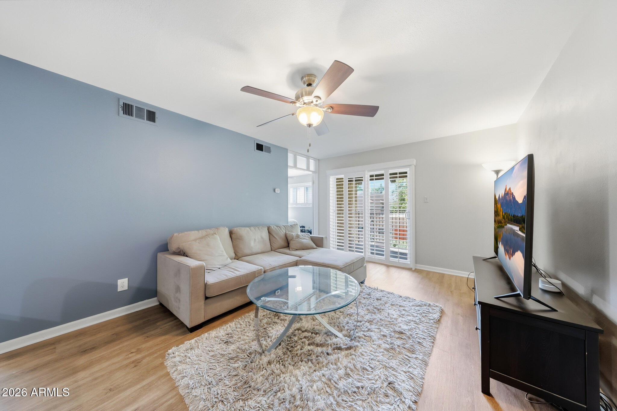 5525 East Thomas Road, Unit R 16 Phoenix, AZ 85018 - Photo 26 of 27 a living room with furniture and a flat screen tv