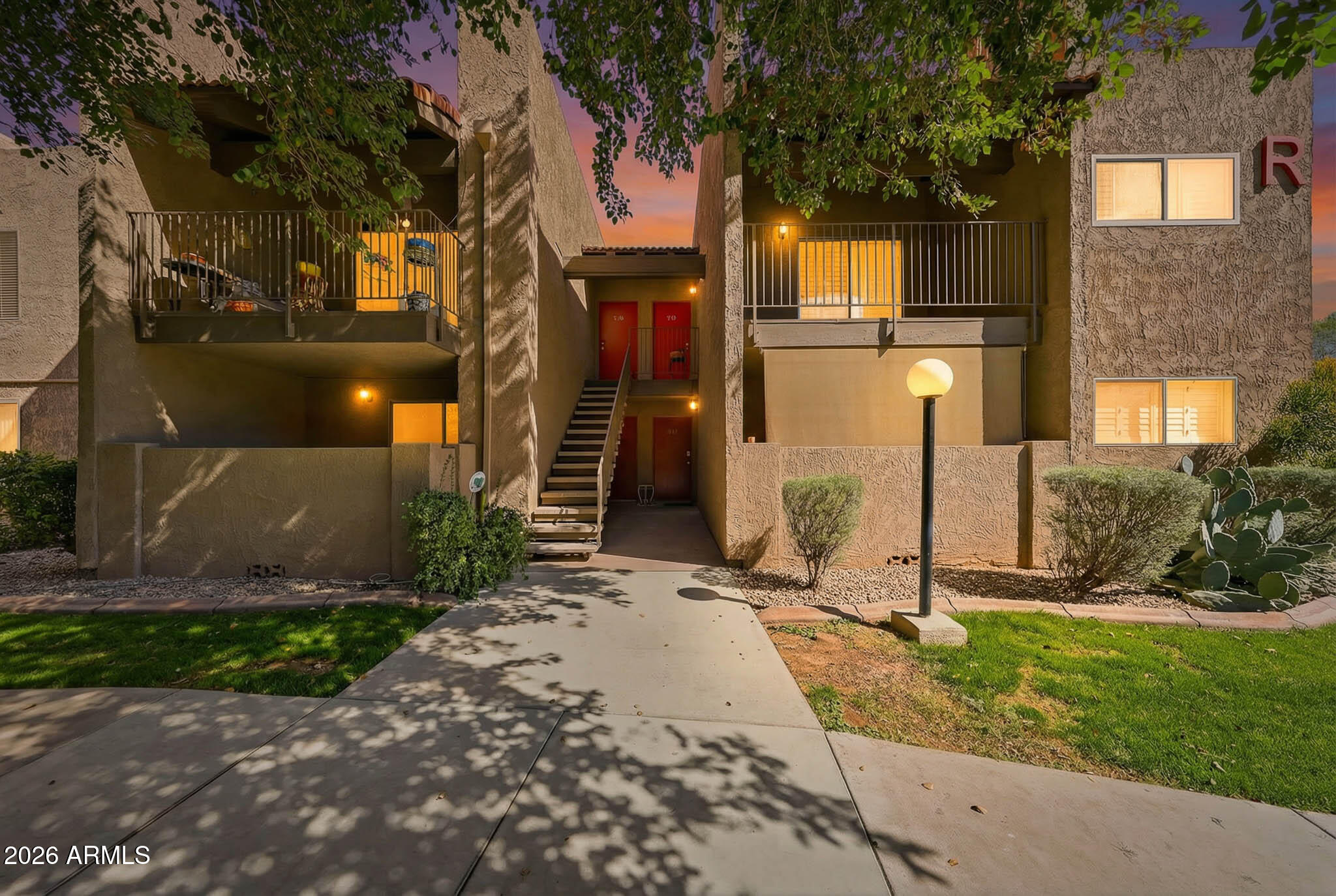 5525 East Thomas Road, Unit R 16 Phoenix, AZ 85018 - Photo 5 of 27 a front view of a house with a yard