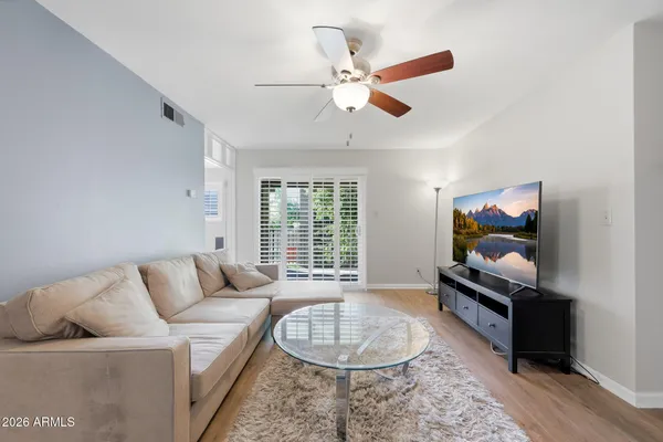 a living room with furniture and a flat screen tv