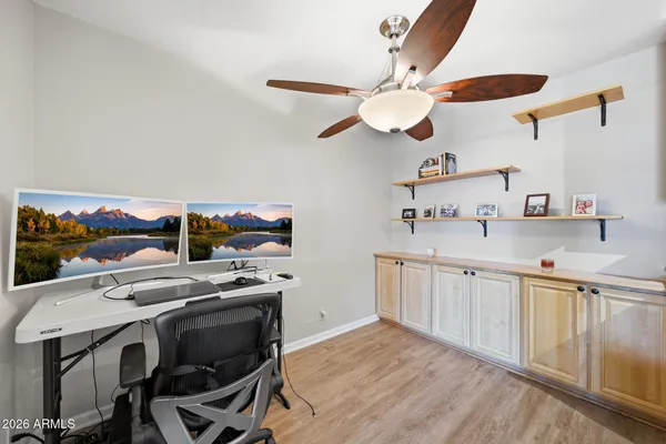 a kitchen with a stove a sink and a microwave