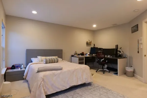 a bedroom with a bed and furniture