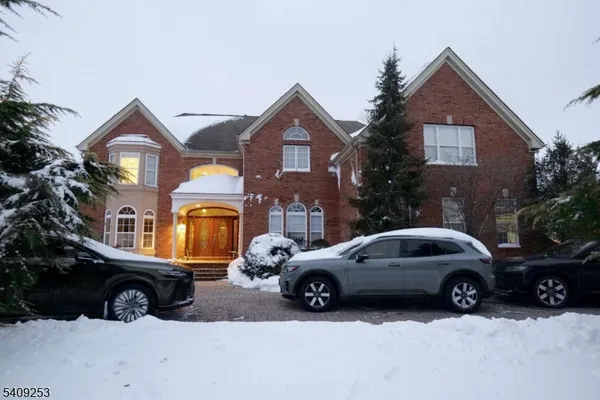 a view of a car parked in front of a house