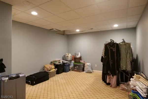 a bedroom with a bed and a walk in closet