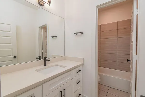 a bathroom with a sink and a bathtub