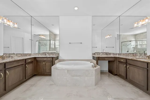 a bathroom with a shower sink and mirror