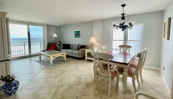 a kitchen with granite countertop a refrigerator and a sink
