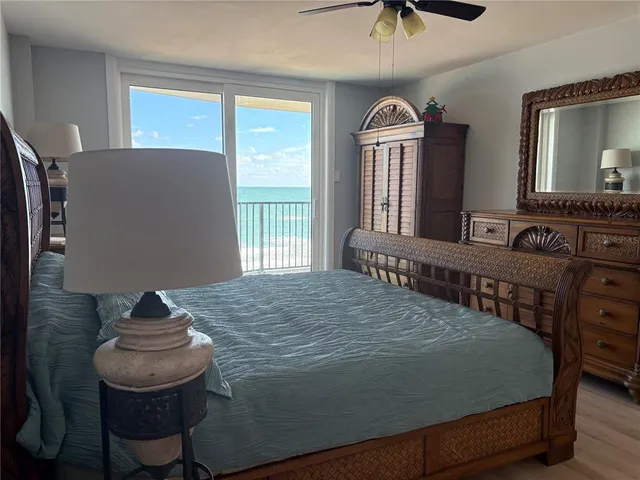 a bathroom with a granite countertop shower a mirror and a sink