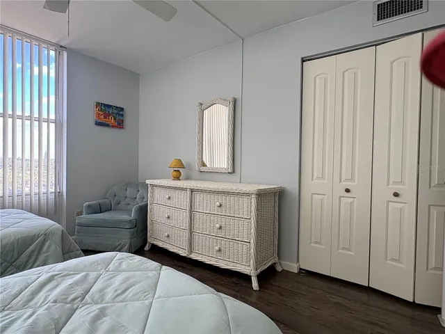 a bathroom with a sink a toilet a tub and shower