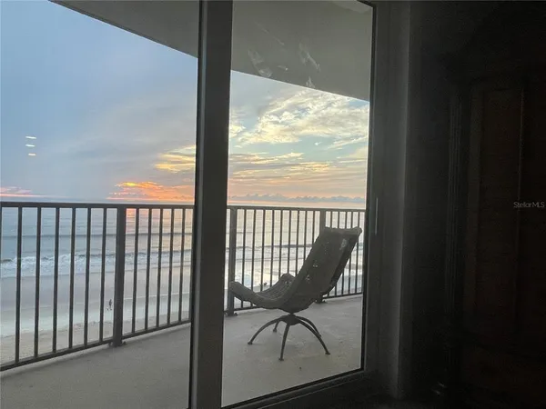 a balcony with wooden floor