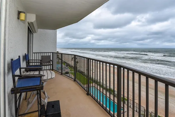 a view of parking garage with cars