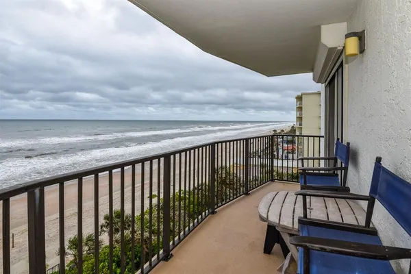 a view of balcony with wooden floor