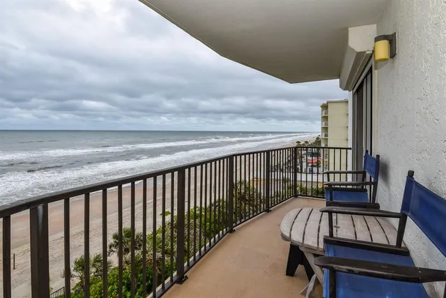 a view of balcony with wooden floor