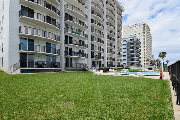 a view of a swimming pool with a lounge chairs