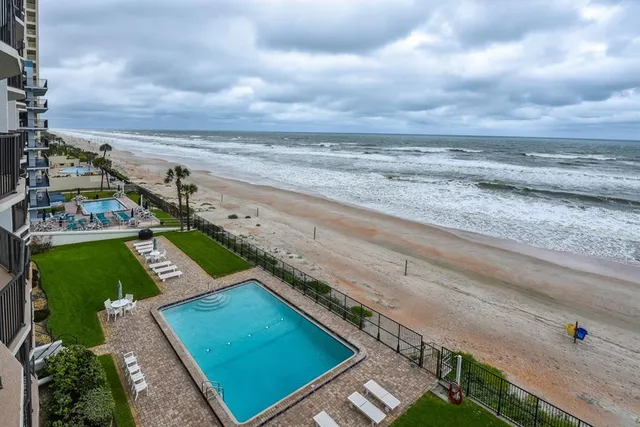 a view of an ocean and a building