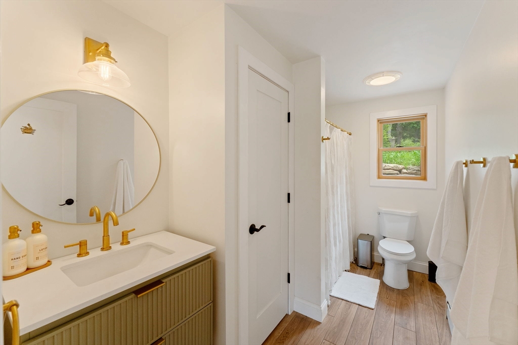 22 Potter Road Douglas, MA 01516 - Photo 19 of 40 a bathroom with a sink toilet and a mirror
