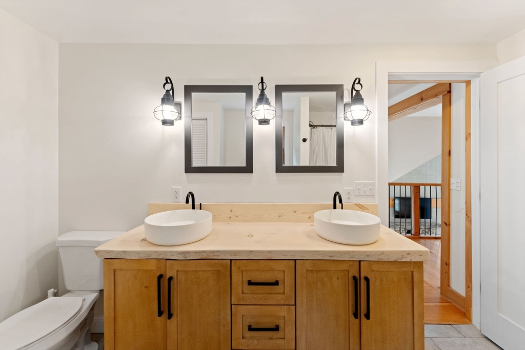 22 Potter Road Douglas, MA 01516 - Photo 31 of 40 a bathroom with a sink and a mirror