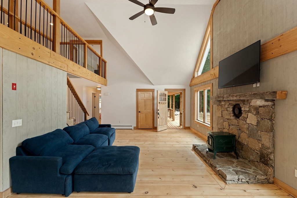 22 Potter Road Douglas, MA 01516 - Photo 6 of 40 a living room with furniture and a flat screen tv