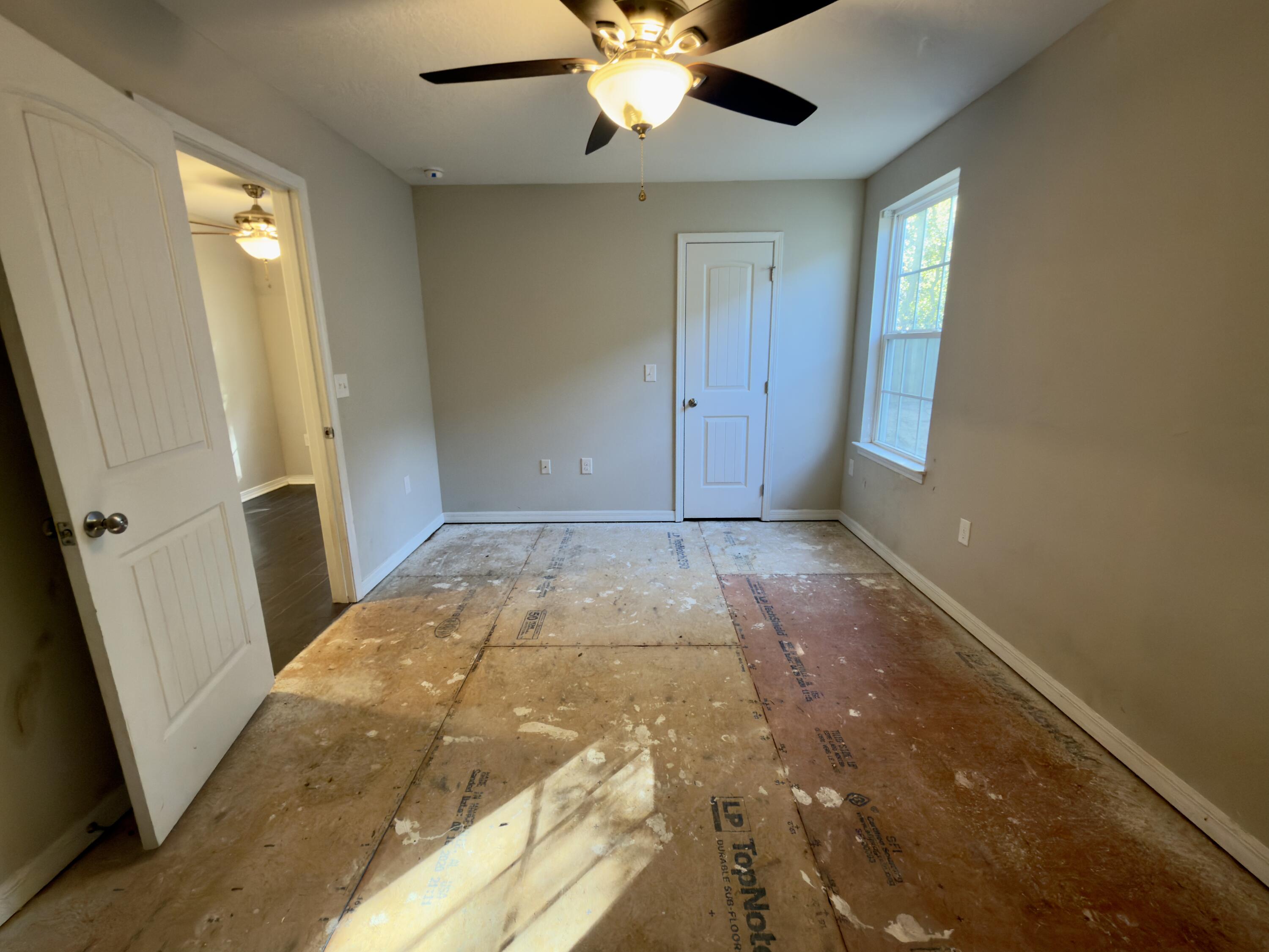 201 Wainwright Drive Crestview, FL 32539 - Photo 21 of 26 wooden floor in an empty room with a window