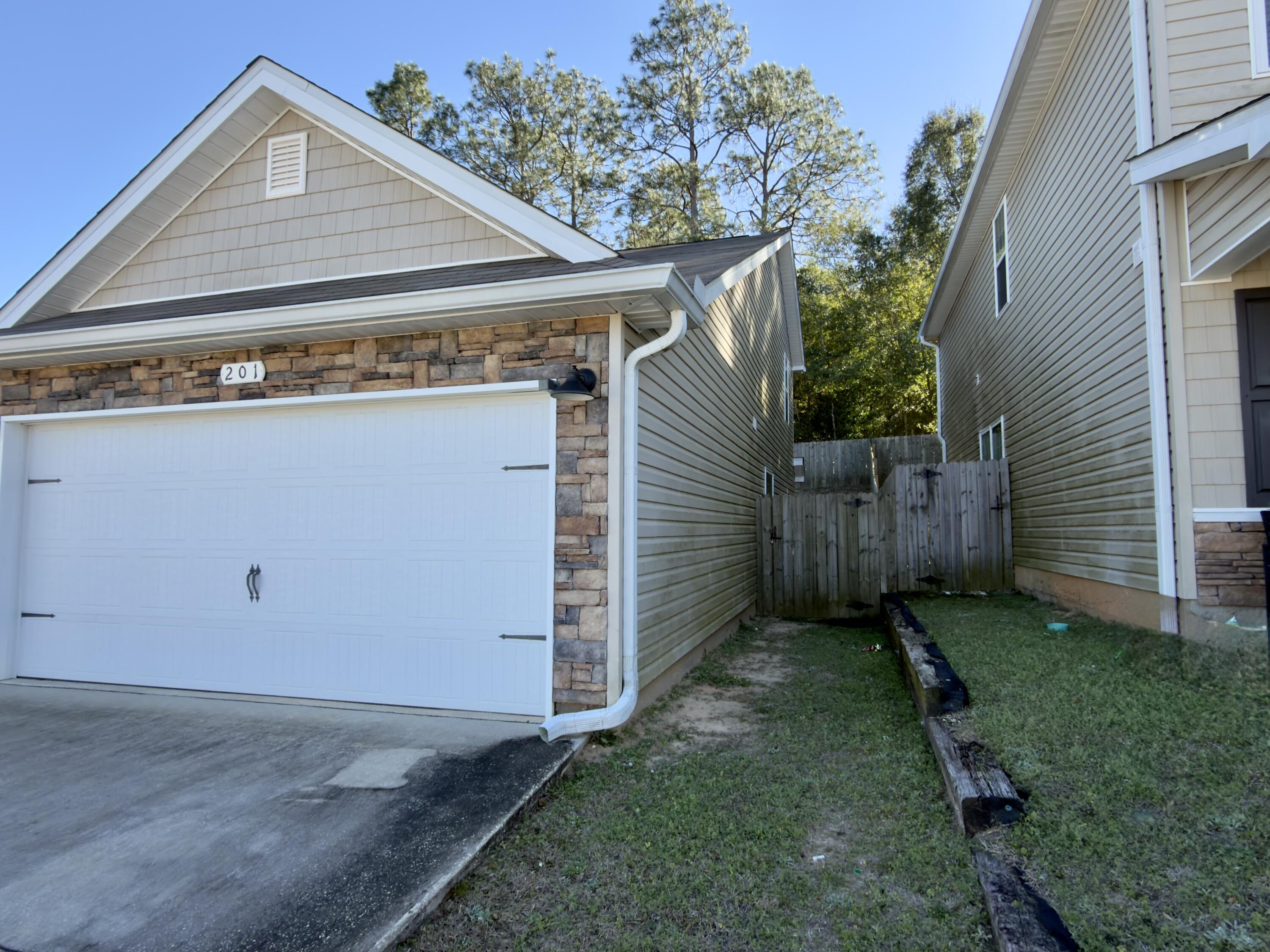 201 Wainwright Drive Crestview, FL 32539 - Photo 22 of 26 a view of a house with a backyard