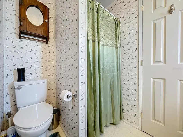 an aerial view of a house with a lake view