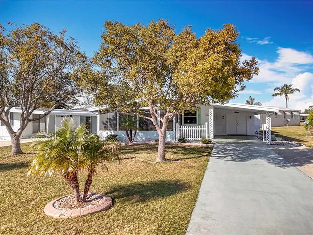 a dining room with furniture and a chandelier