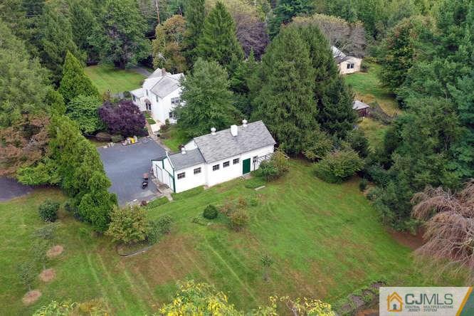 963 Ridge Road Princeton, NJ 08540 - Photo 2 of 25 an aerial view of a house with a yard