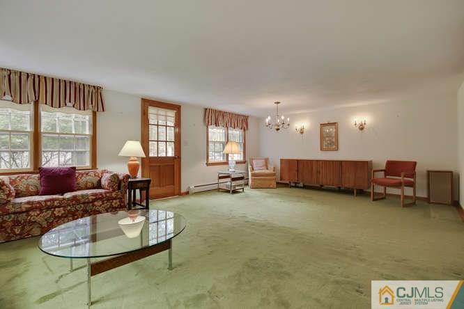 963 Ridge Road Princeton, NJ 08540 - Photo 11 of 25 a living room with furniture and a large window