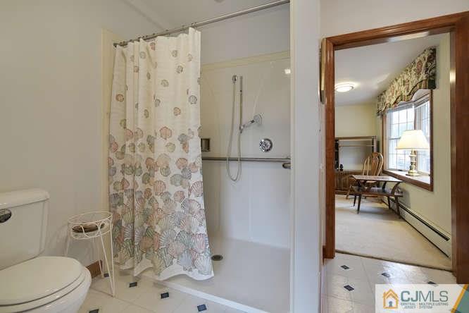 963 Ridge Road Princeton, NJ 08540 - Photo 13 of 25 a bathroom with a shower toilet and sink