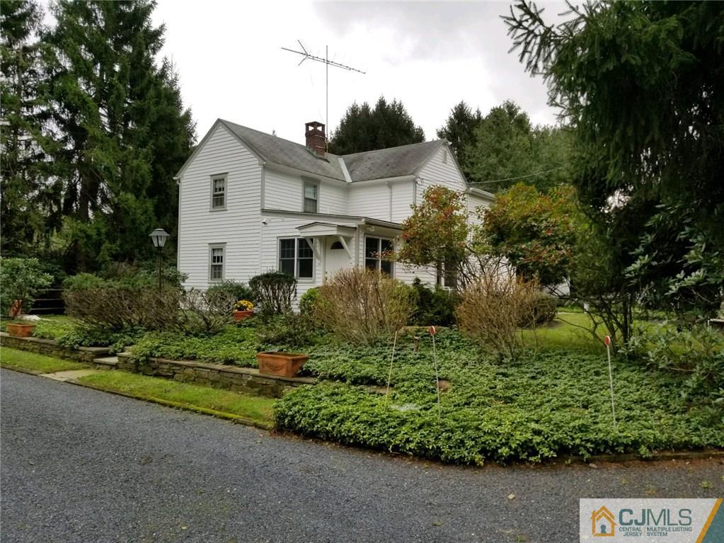 963 Ridge Road Princeton, NJ 08540 - Photo 3 of 25 a front view of a house with a yard
