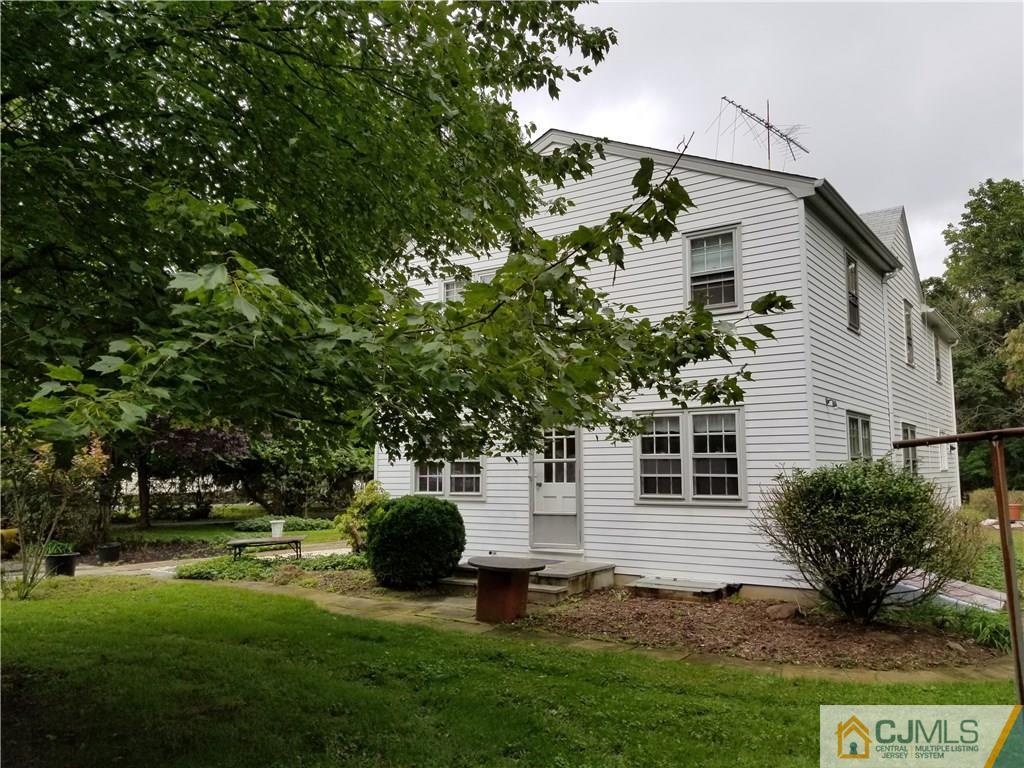 963 Ridge Road Princeton, NJ 08540 - Photo 7 of 25 a white house that has a tree in front of it