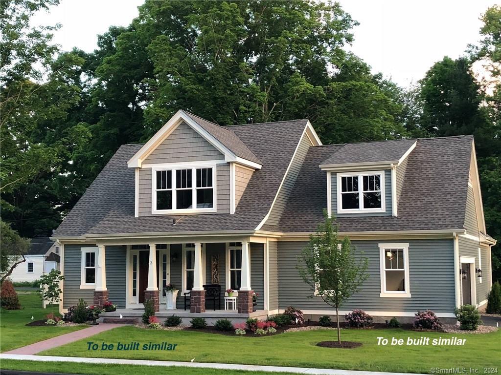 8 Applegate Lane, Unit 8 Canton, CT 06019 - Photo 1 of 1 front view of a house with a yard