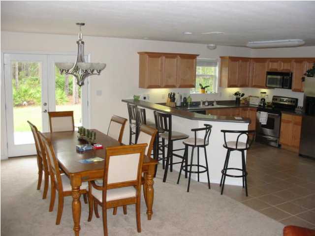 48 Red Maple Court Santa Rosa Beach, FL 32459 - Photo 3 of 5 a view of a dining room with furniture window and outside view