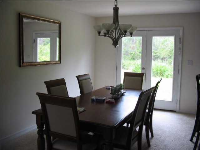 48 Red Maple Court Santa Rosa Beach, FL 32459 - Photo 4 of 5 a view of a dining room with furniture window and outside view