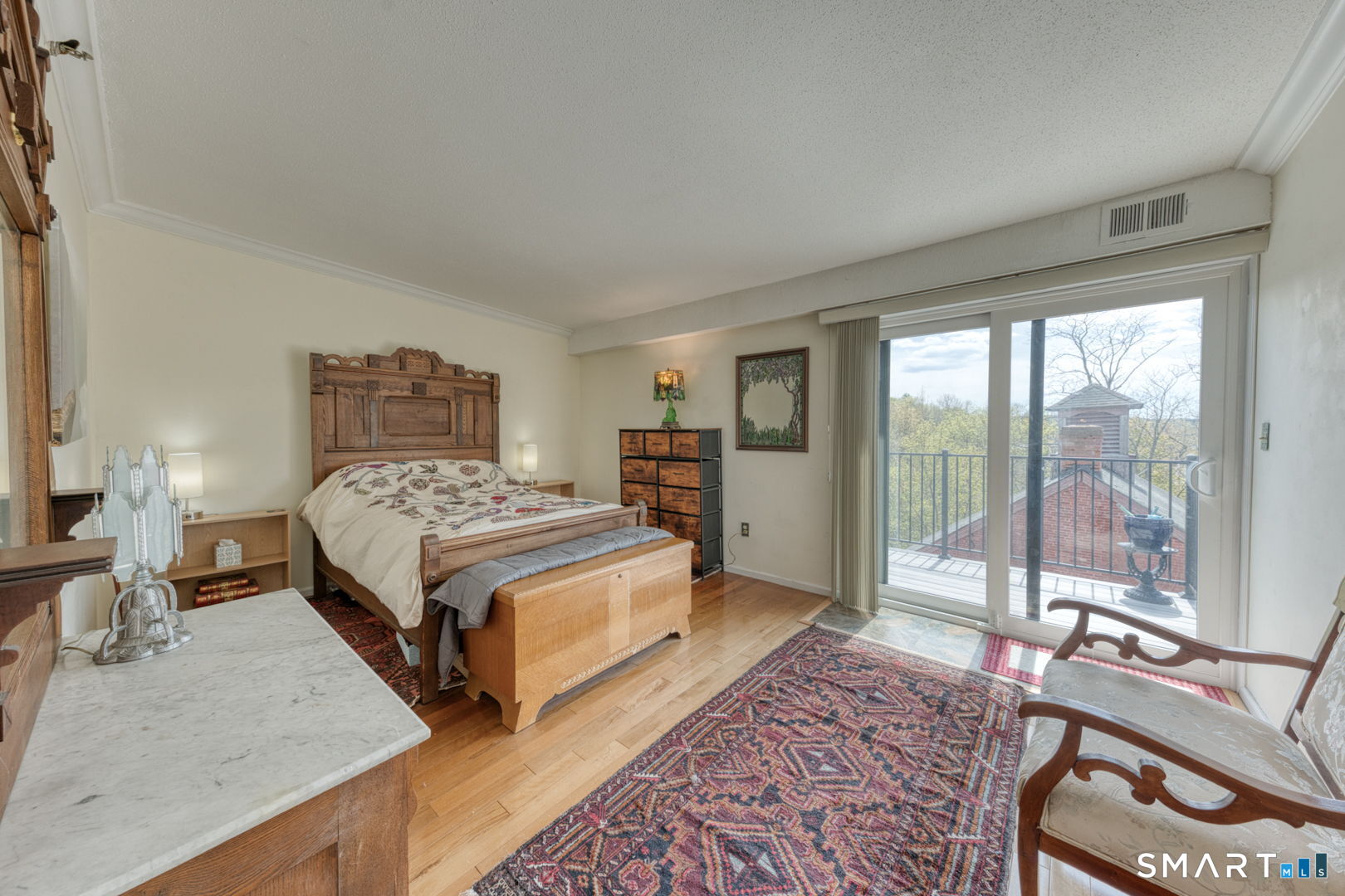 234 South Main Street, Unit 416 Middletown, CT 06457 - Photo 17 of 37 a bedroom with a bed and large windows