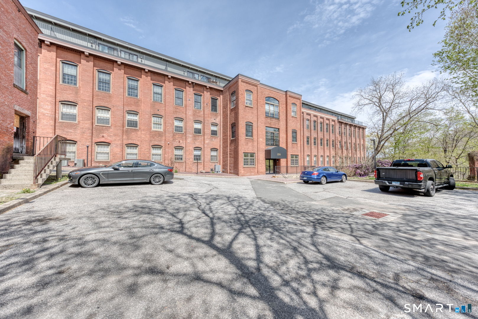 234 South Main Street, Unit 416 Middletown, CT 06457 - Photo 2 of 37 a building with car parked in front of it