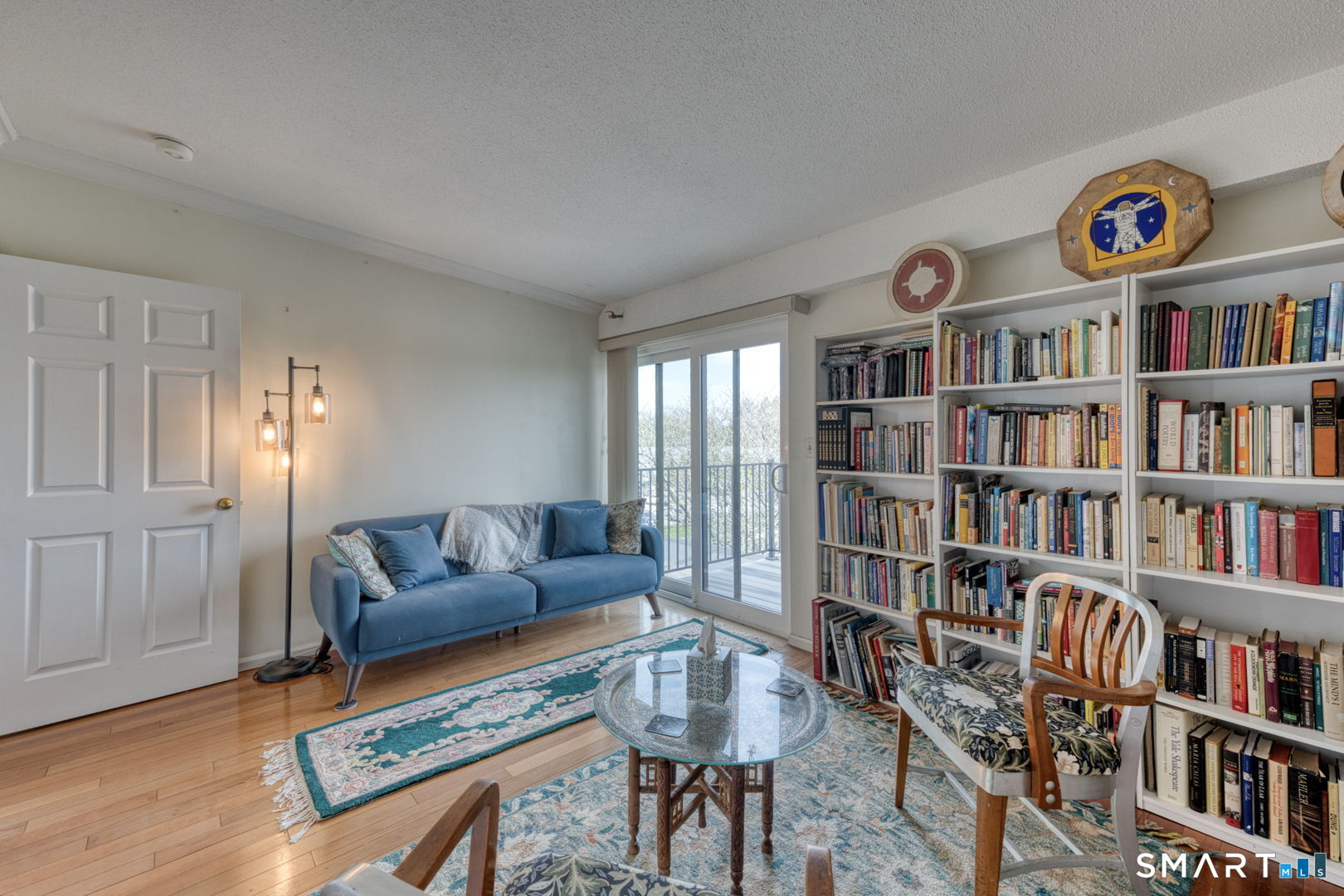 234 South Main Street, Unit 416 Middletown, CT 06457 - Photo 23 of 37 a living room with furniture and a book shelf