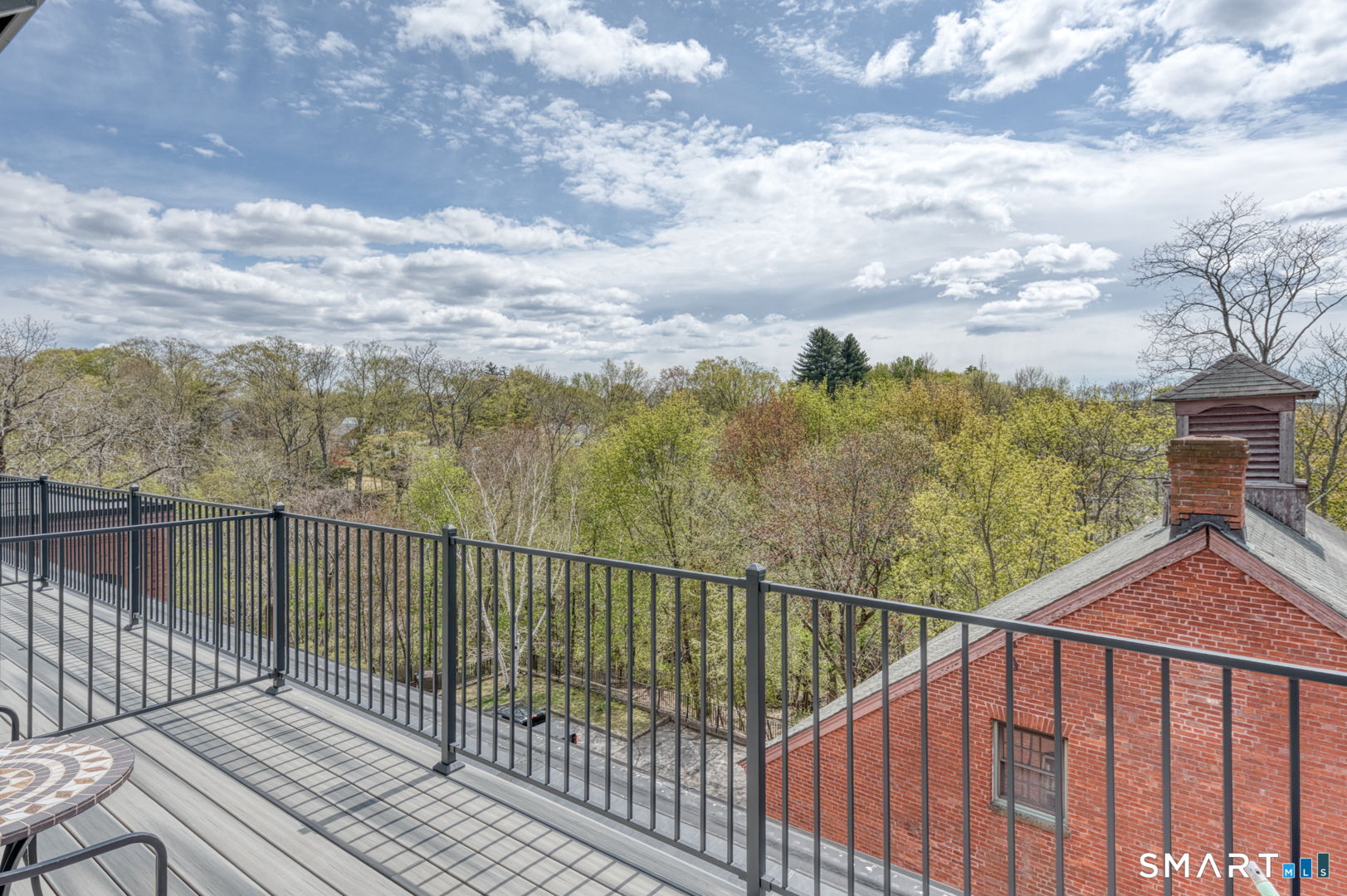 234 South Main Street, Unit 416 Middletown, CT 06457 - Photo 27 of 37 a view of a balcony with wooden fence and floor