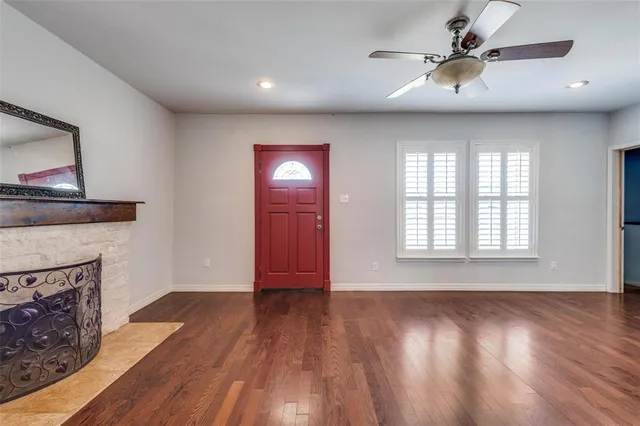 a view of livingroom with hardwood floor and a fireplace
