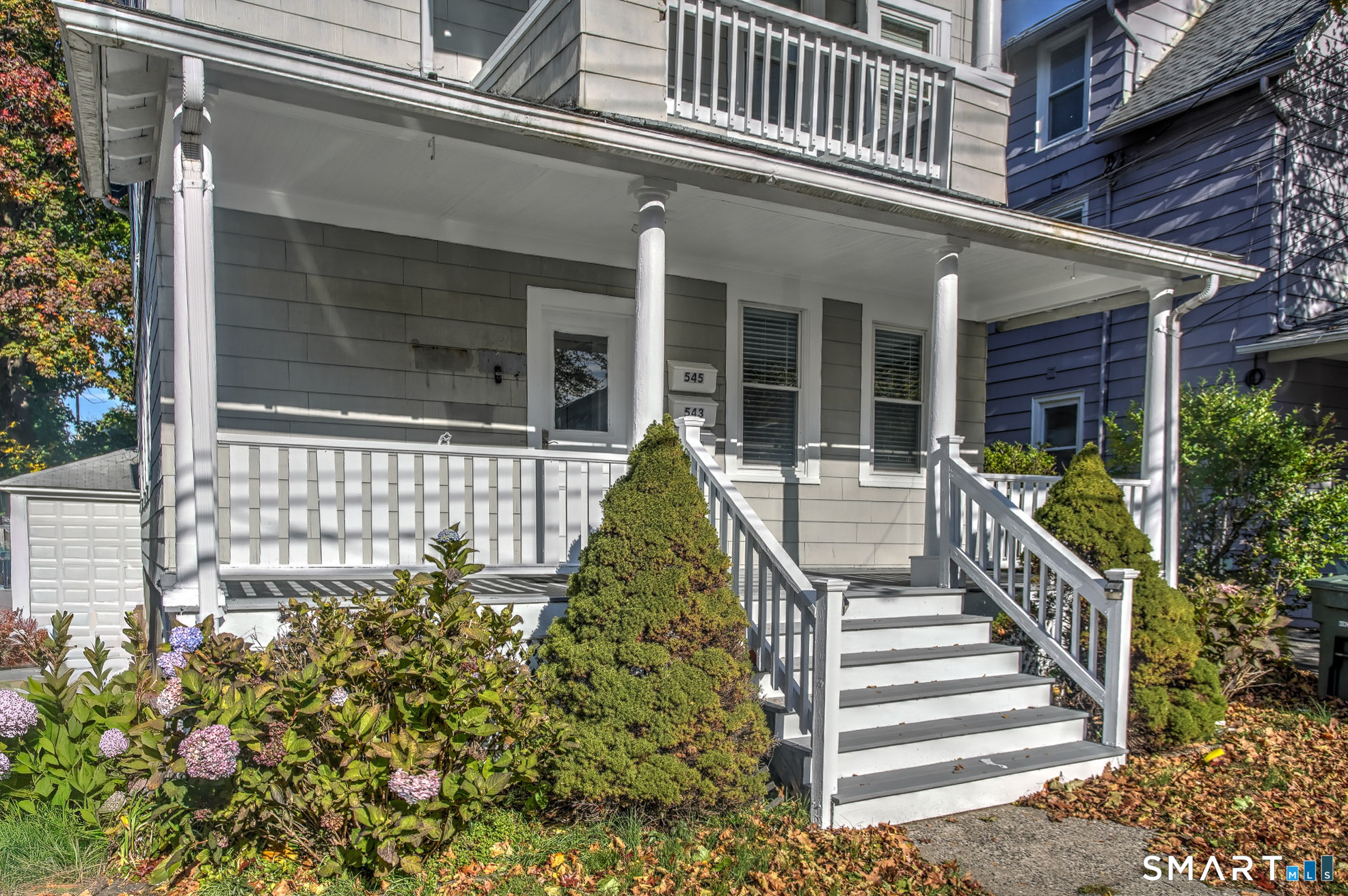 543 Midland Street Bridgeport, CT 06605 - Photo 2 of 7 front view of a house with a porch