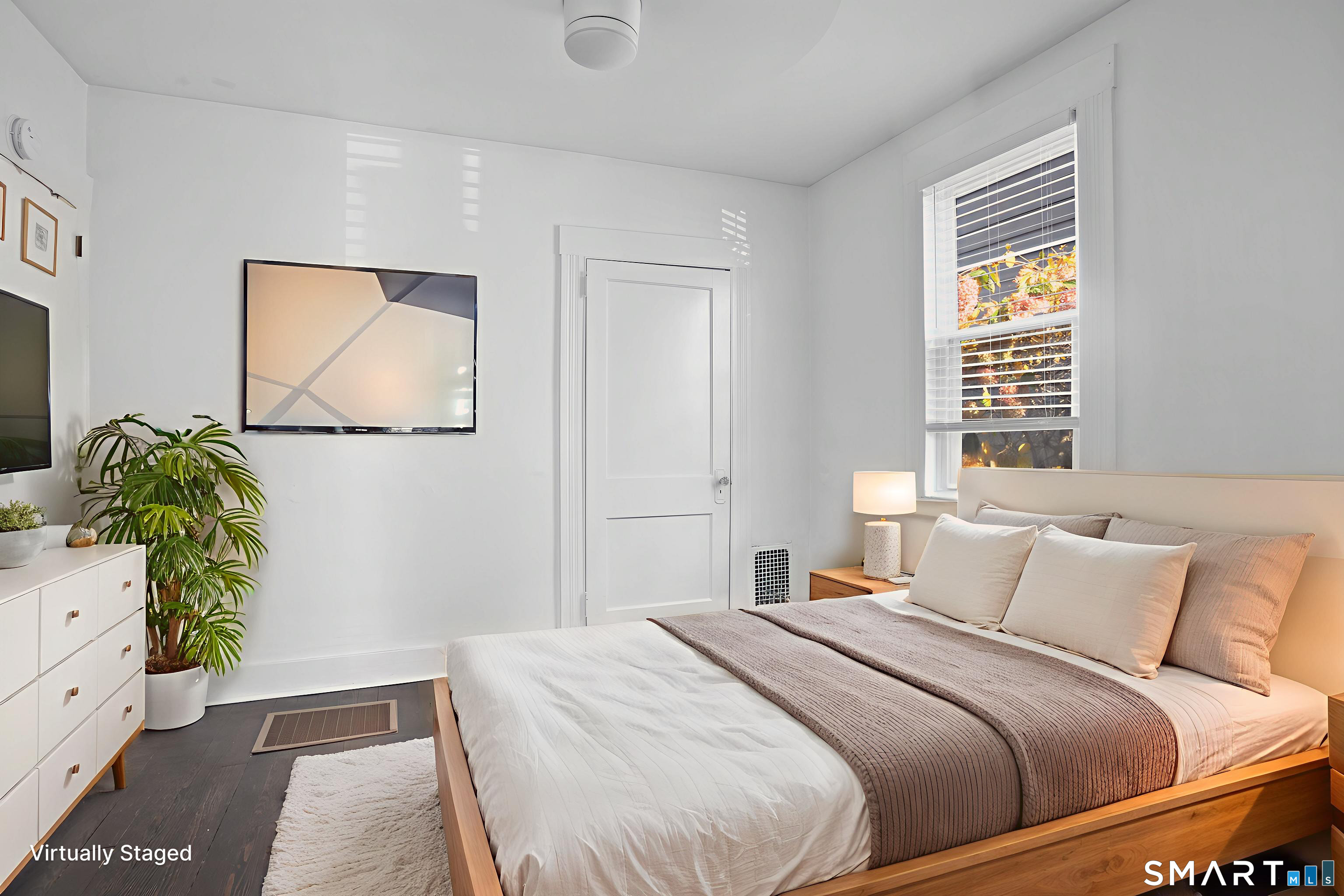 543 Midland Street Bridgeport, CT 06605 - Photo 5 of 7 a bedroom with a bed and a potted plant