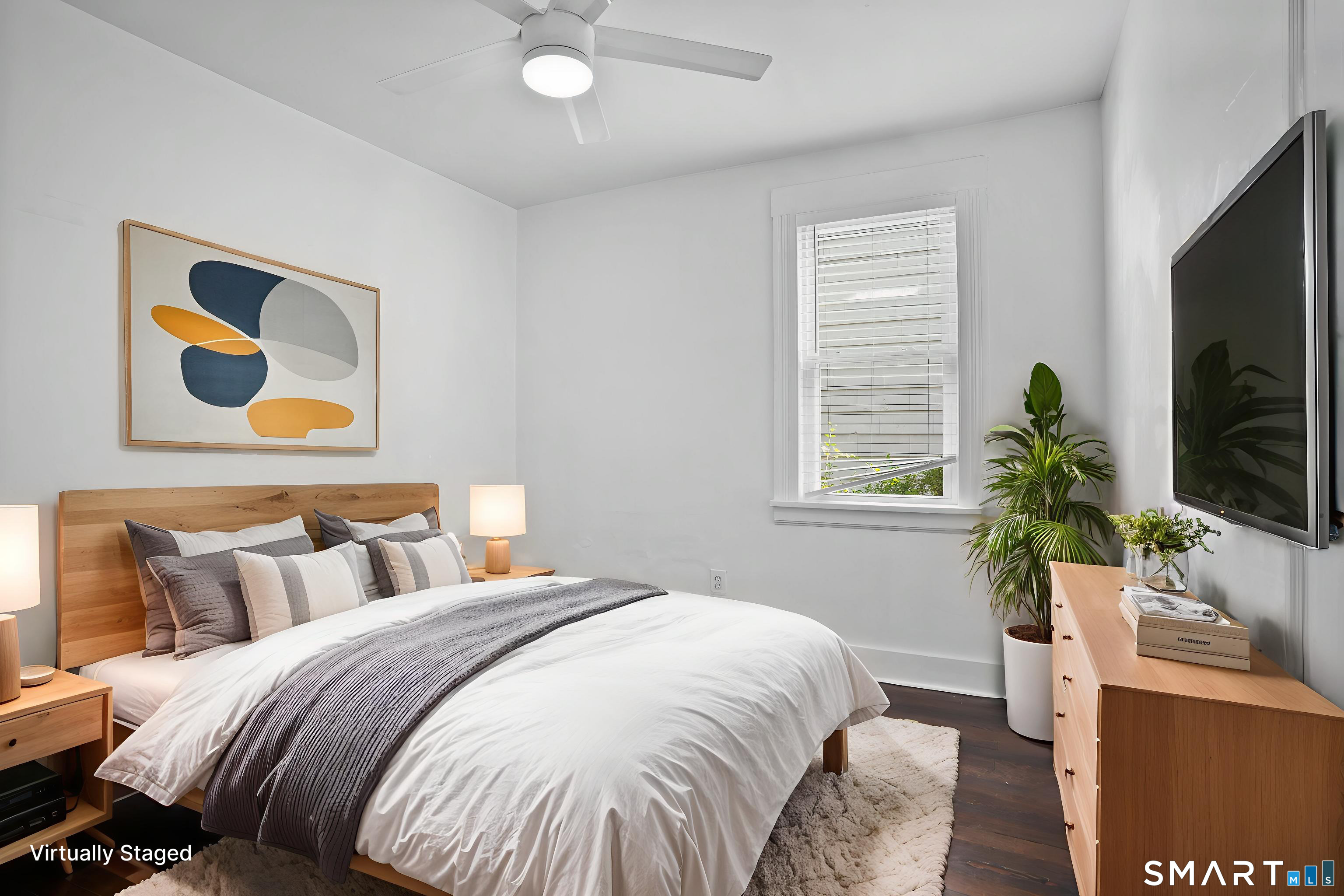 543 Midland Street Bridgeport, CT 06605 - Photo 7 of 7 a bedroom with bed and a flat screen tv