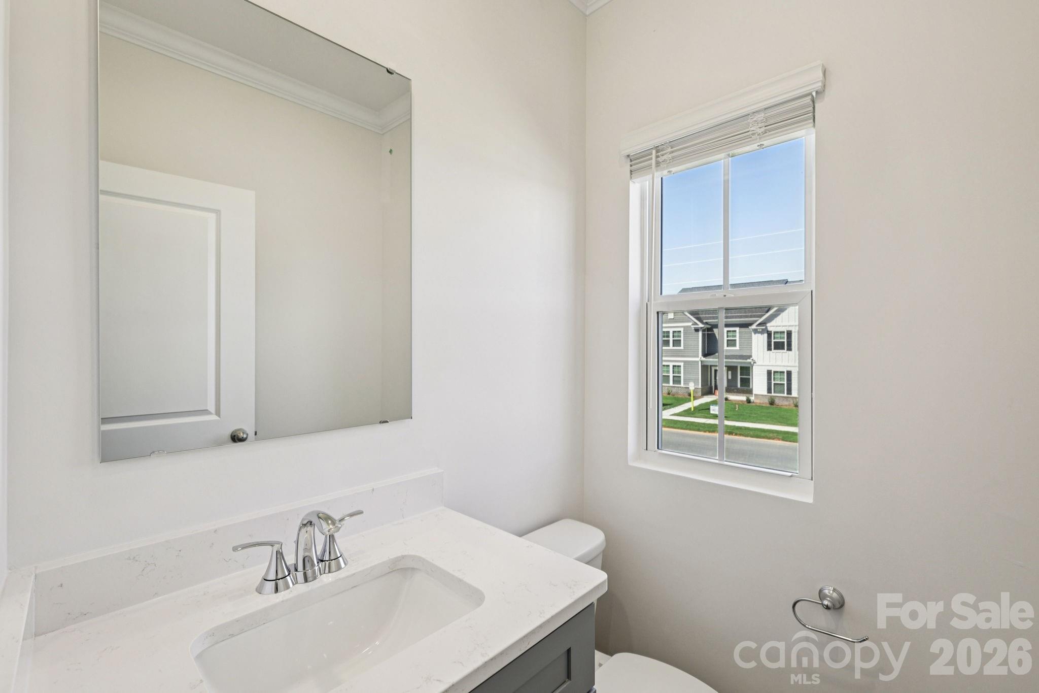 335 Golden Maple Court Fort Mill, SC 29708 - Photo 12 of 26 a bathroom with a sink vanity and a toilet