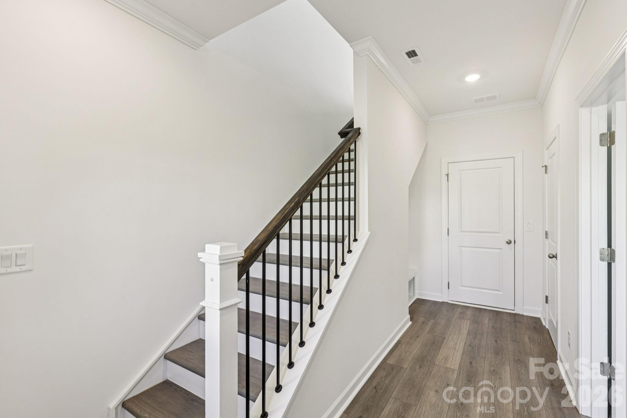 335 Golden Maple Court Fort Mill, SC 29708 - Photo 3 of 26 a view of a hallway with wooden floor and entryway