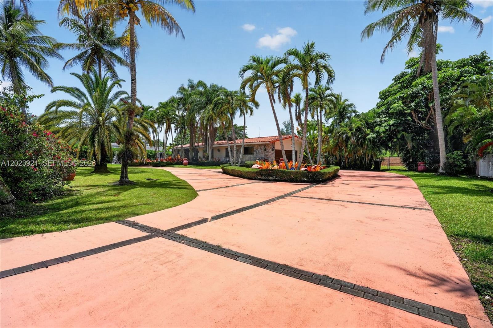 8461 Southwest 68th St Road Miami, FL 33143 - Photo 21 of 65 a view of a yard with palm trees