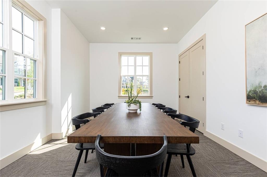 3373 Fence Road Northeast, Unit TH2 Dacula, GA 30019 - Photo 16 of 36 a view of a dining room with furniture and window