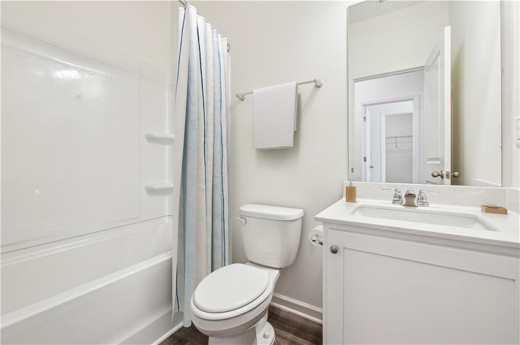 3373 Fence Road Northeast, Unit TH2 Dacula, GA 30019 - Photo 32 of 36 a bathroom with a sink toilet and shower