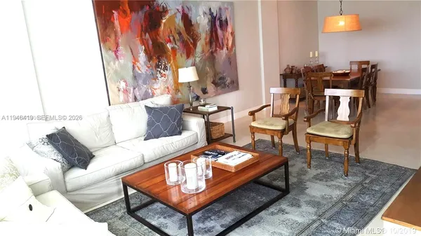 a living room with furniture and a rug