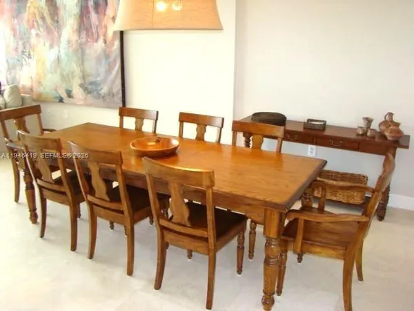 a view of an outside dining space with furniture