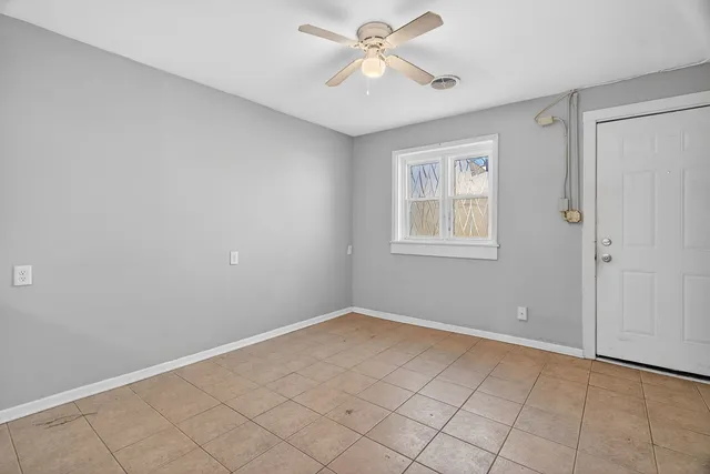 a view of kitchen with furniture and window